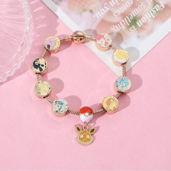 ⭐️NEW⭐️ Gold Plated & Enameled Pokémon Eevee Eeveelution Themed Charm Bracelet - Picture 6 of 8